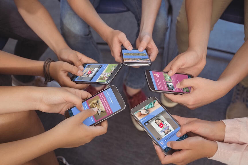 Knowva - App Users A group of young people using the Knowva app on all of their devices, to explore different articles and videos.
